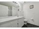 Simple bathroom boasts a white vanity, mirror, and shower at 6108 Lanshire Dr, Tampa, FL 33634