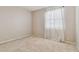 Well-lit bedroom with large window and neutral decor at 2303 Hannah N Way, Dunedin, FL 34698