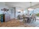 Elegant dining room featuring a wooden table and statement art at 140 Riviera Dunes Way # 303, Palmetto, FL 34221