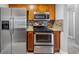 Modern kitchen featuring stainless steel appliances and wood cabinets at 306 S Habana Ave # 3, Tampa, FL 33609