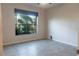 Spacious bedroom with large window and tile floor at 1134 S Pointe Alexis Dr, Tarpon Springs, FL 34689