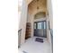 Front entry featuring a dark-stained door and a small shelf at 1134 S Pointe Alexis Dr, Tarpon Springs, FL 34689
