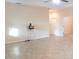 Large living room with tile floors, neutral walls, and ceiling fan at 1134 S Pointe Alexis Dr, Tarpon Springs, FL 34689