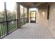 Spacious screened balcony overlooking a tranquil pond at 1134 S Pointe Alexis Dr, Tarpon Springs, FL 34689