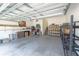 Spacious garage with overhead storage and ample shelving at 1134 S Pointe Alexis Dr, Tarpon Springs, FL 34689