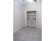 Spacious closet with shelves and hanging rod at 1134 S Pointe Alexis Dr, Tarpon Springs, FL 34689