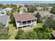 Aerial view of home with screened porch at 1134 S Pointe Alexis Dr, Tarpon Springs, FL 34689