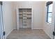 Built-in closet with shelves and hanging rod at 1134 S Pointe Alexis Dr, Tarpon Springs, FL 34689