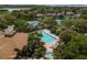 Community pool and tennis courts with lush landscaping at 1134 S Pointe Alexis Dr, Tarpon Springs, FL 34689