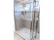 Shower with glass enclosure and built-in seat at 1134 S Pointe Alexis Dr, Tarpon Springs, FL 34689