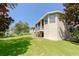 Elevated back deck overlooking grassy yard and lake at 1134 S Pointe Alexis Dr, Tarpon Springs, FL 34689