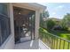 Screened balcony offering backyard and neighborhood views at 1134 S Pointe Alexis Dr, Tarpon Springs, FL 34689
