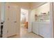 Convenient laundry room with washer, dryer, and storage shelves at 1134 S Pointe Alexis Dr, Tarpon Springs, FL 34689