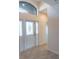 The foyer features tile flooring and a door to the rest of the house at 1134 S Pointe Alexis Dr, Tarpon Springs, FL 34689