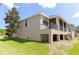 Home exterior with screened porch and deck at 1134 S Pointe Alexis Dr, Tarpon Springs, FL 34689