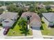 Aerial view of single-Gathering home with palm trees at 1134 S Pointe Alexis Dr, Tarpon Springs, FL 34689