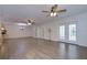 Spacious living room featuring hardwood floors and ceiling fans at 4008 Greenmark Ln, Valrico, FL 33596