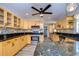 Modern kitchen with granite countertops and stainless steel appliances at 4008 Greenmark Ln, Valrico, FL 33596