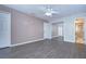 Spacious bedroom with mirrored closet doors and wood-look flooring at 4008 Greenmark Ln, Valrico, FL 33596