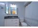 Clean bathroom with white vanity, granite countertop, and updated fixtures at 4008 Greenmark Ln, Valrico, FL 33596
