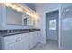 Bathroom with double vanity and walk-in shower at 4008 Greenmark Ln, Valrico, FL 33596