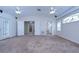 Primary bedroom with carpet, ceiling fan, and access to bathroom at 4008 Greenmark Ln, Valrico, FL 33596
