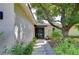 Front entry with walkway, landscaping, and brick exterior at 4008 Greenmark Ln, Valrico, FL 33596