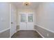 Bright and airy entryway with double doors and wood floors at 4008 Greenmark Ln, Valrico, FL 33596