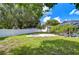 Large backyard with a white fence and grassy area at 4008 Greenmark Ln, Valrico, FL 33596