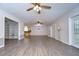 Bright living room featuring hardwood floors and a view into the kitchen at 4008 Greenmark Ln, Valrico, FL 33596