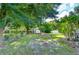 Landscaped backyard with shed and lush greenery at 4008 Greenmark Ln, Valrico, FL 33596