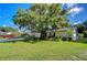 House exterior featuring brick facade and landscaping at 4008 Greenmark Ln, Valrico, FL 33596