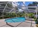 Relaxing kidney-shaped pool with screened patio at 4008 Greenmark Ln, Valrico, FL 33596