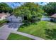 Beautiful house exterior with a large tree and well-maintained lawn at 4008 Greenmark Ln, Valrico, FL 33596