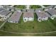 Aerial view of houses with backyard patios and green lawns at 3729 Capri Coast Dr, Plant City, FL 33565