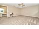 Bright bedroom with carpet, ceiling fan, and en-suite bathroom access at 4612 Landscape Dr, Tampa, FL 33624