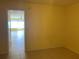 Small room with yellow walls and tiled floor at 1257 Drew St # 9, Clearwater, FL 33755