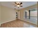 Light and airy bedroom with wood-look floors and a window at 2022 Gregory Dr, Tampa, FL 33613