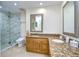 Elegant bathroom with granite countertops, a large shower, and a modern toilet at 29909 Baywood Ln, Wesley Chapel, FL 33543