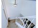 Bright white staircase with wood flooring at 29909 Baywood Ln, Wesley Chapel, FL 33543