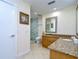 Elegant bathroom with granite countertops, a large shower, and a modern toilet at 29909 Baywood Ln, Wesley Chapel, FL 33543