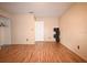 Spacious bedroom with wood floors and a closet featuring built-in shelving at 10223 Us Highway 301, Dade City, FL 33525