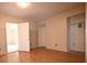 Bedroom with light, laminate wood flooring and walk-in closet space available at 10223 Us Highway 301, Dade City, FL 33525