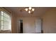 Comfortable empty bedroom showcases window with blinds and curtains, neutral paint, and ceiling fan at 10223 Us Highway 301, Dade City, FL 33525