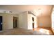 A view of an open-concept living room showcasing a dining area with hardwood floors and a neutral-toned carpet at 10223 Us Highway 301, Dade City, FL 33525