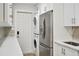 Modern laundry room with washer, dryer, and ample storage at 201 27Th S St, St Petersburg, FL 33712