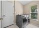 Laundry room with washer and dryer, plus extra storage at 4153 Waterville Ave, Wesley Chapel, FL 33543