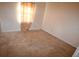 Simple bedroom with neutral carpeting and a window at 10223 Us Highway 301, Dade City, FL 33525