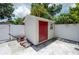 White shed with a red door at 201 27Th S St, St Petersburg, FL 33712