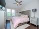 Main bedroom with king-size bed and plush bedding at 9107 Carolina Wren Dr, Tampa, FL 33626